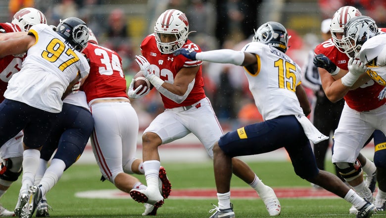 Taylor scores 5 TDs to lead No. 8 Wisconsin past Kent State