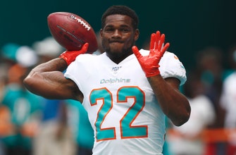 The Latest: Dolphins release Walton after battering arrest