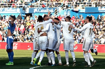 
					Varane helps Real Madrid win 3-0 at Getafe
				