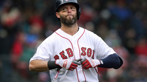 Boston Red Sox's Dustin Pedroia takes off his gloves after lining out to right field to end the sixth inning of the home opener baseball game against the Toronto Blue Jays in Boston. Re