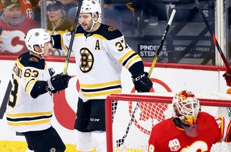 Bergeron scores twice as Bruins beat Flames 4-3