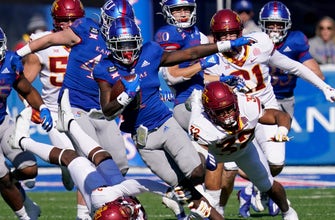 Kansas struggles to contain No. 23 Iowa State, falls 52-22
