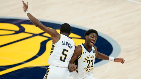 Indiana Pacers' Caris LeVert (22) and Edmond Sumner (5) celebrate during the second half of an NBA basketball game, Wednesday, March 24, 2021, in Indianapolis. The Pacers won 116-111. (AP Photo/Darron Cummings)