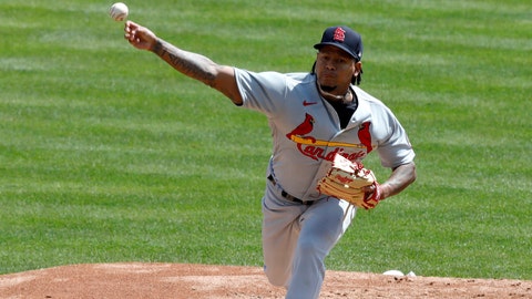 Apr 4, 2021; Cincinnati, Ohio, USA; St. Louis Cardinals starting pitcher Carlos Martinez (18) throws against the Cincinnati Reds during the first inning at Great American Ball Park. Mandatory Credit: David Kohl-USA TODAY Sports