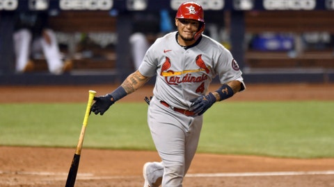 St. Louis Cardinals' Yadier Molina drops his bat after hitting a sacrifice fly during the sixth inning of the team's baseball game against the Miami Marlins, Tuesday, April 6, 2021, in Miami. (AP Photo/Jim Rassol)