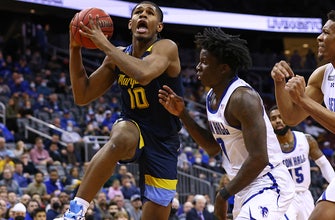 
					Justin Lewis drops a career-high 33 points, Marquette holds off Seton Hall in 73-63 victory
				