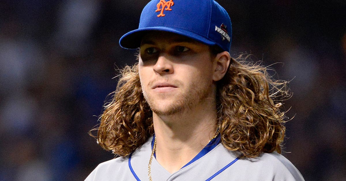Jacob deGrom's Blue Jersey and Long Hair: A Fashion Statement on the Field - wide 1